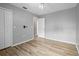 Simple bedroom with light grey walls and wood-look flooring at 1210 Kenway Ave, Deltona, FL 32738