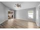 Bright living room with hardwood floors and sliding glass doors at 1210 Kenway Ave, Deltona, FL 32738