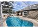 Relaxing screened pool with waterfall feature at 1210 Kenway Ave, Deltona, FL 32738