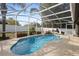 Refreshing kidney-shaped pool with screened enclosure at 1210 Kenway Ave, Deltona, FL 32738