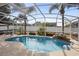 Sparkling, screened pool with waterfall feature in backyard at 1210 Kenway Ave, Deltona, FL 32738