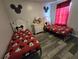 bedroom with twin beds featuring Mickey Mouse bedding at 1230 Las Fuentes Dr, Kissimmee, FL 34746