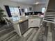 Kitchen island featuring granite countertops and stainless steel appliances at 1230 Las Fuentes Dr, Kissimmee, FL 34746