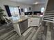 Kitchen island with granite countertop and sink at 1230 Las Fuentes Dr, Kissimmee, FL 34746