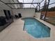 Inviting screened-in pool with patio furniture at 1230 Las Fuentes Dr, Kissimmee, FL 34746