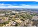 Aerial view of property showing home, landscape, and surrounding area at 1267 Varnado Rd, Groveland, FL 34736