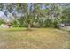 Spacious backyard with large tree and fenced perimeter at 1267 Varnado Rd, Groveland, FL 34736