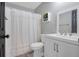 Updated bathroom with white vanity and shower/tub combo at 1267 Varnado Rd, Groveland, FL 34736