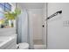 Clean bathroom with a shower and white tile at 1267 Varnado Rd, Groveland, FL 34736