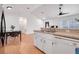 Kitchen features white cabinetry and a double sink at 1267 Varnado Rd, Groveland, FL 34736