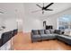 Living area featuring grey sectional and kitchen access at 1267 Varnado Rd, Groveland, FL 34736