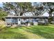 Backyard view of home with deck and patio furniture at 128 Tildenville School Rd, Winter Garden, FL 34787