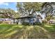 Side yard view of home with large grassy area at 128 Tildenville School Rd, Winter Garden, FL 34787