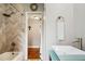 Bathroom with herringbone tile and a shower at 128 Tildenville School Rd, Winter Garden, FL 34787