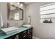 Bathroom with double vanity and pebble floor at 128 Tildenville School Rd, Winter Garden, FL 34787