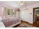 Light pink bedroom with double bed and closet at 128 Tildenville School Rd, Winter Garden, FL 34787