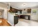 Modern kitchen with dark cabinets and granite countertops at 128 Tildenville School Rd, Winter Garden, FL 34787