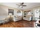 Living room with hardwood floors and two beige sofas at 128 Tildenville School Rd, Winter Garden, FL 34787