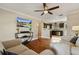 Open living room and kitchen with hardwood floors at 128 Tildenville School Rd, Winter Garden, FL 34787