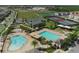 Aerial view of community pool, tennis courts, and playground at 13586 Abberwick Dr, Orlando, FL 32832