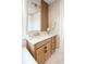 Light wood vanity with white countertop and hexagon tile floor at 13586 Abberwick Dr, Orlando, FL 32832