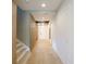 Light and bright hallway with hardwood floors and wainscoting at 13586 Abberwick Dr, Orlando, FL 32832