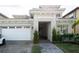 Two-story house with a white garage door and a landscaped front yard at 13586 Abberwick Dr, Orlando, FL 32832