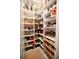 Well-organized pantry with ample shelving for food storage at 13586 Abberwick Dr, Orlando, FL 32832