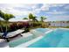 Relaxing pool area with spa, hammock, and chaise lounges at 13586 Abberwick Dr, Orlando, FL 32832