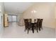 Bright dining area with glass-top table and six chairs at 13917 Timberland Dr # 201, Orlando, FL 32824