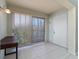 Light and airy entryway with tiled floors and sliding glass doors at 13917 Timberland Dr # 201, Orlando, FL 32824