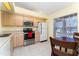 Bright kitchen with stainless steel appliances and light wood cabinets at 13917 Timberland Dr # 201, Orlando, FL 32824