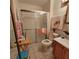 Cozy bathroom with a glass-enclosed shower, neutral tile, and a wood-style vanity at 1420 Thousand Roses S Dr, Lake Wales, FL 33853