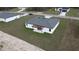 Aerial view of the backyard with a pergola and concrete patio at 15122 Sw 61St Court Rd, Ocala, FL 34473
