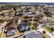 Aerial view of the property and neighborhood at 16143 Palmetto Hill St, Clermont, FL 34714