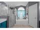 Bathroom with walk-in shower and a soaking tub at 16143 Palmetto Hill St, Clermont, FL 34714