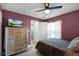 Cozy bedroom with a leopard print comforter and a silver dresser at 16143 Palmetto Hill St, Clermont, FL 34714