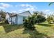 House exterior with light blue siding and landscaping at 16143 Palmetto Hill St, Clermont, FL 34714