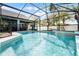 Inviting screened pool with waterfall feature at 16143 Palmetto Hill St, Clermont, FL 34714