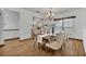 Bright dining room with hardwood floors and a chandelier at 1719 Finley Ave, Apopka, FL 32703