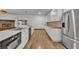 Modern kitchen with white cabinets and butcher block countertops at 1719 Finley Ave, Apopka, FL 32703