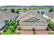 Charming single-story residence features well-manicured landscaping, a brick driveway, and an attached two-car garage at 17597 Summersweet Way, Clermont, FL 34714