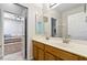 Bathroom with double sinks and wood cabinets at 176 Nandina Ter, Winter Springs, FL 32708