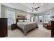 Relaxing main bedroom with tray ceiling, large windows, and ample space at 176 Nandina Ter, Winter Springs, FL 32708