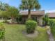 Tan house with sliding glass doors and tropical landscaping at 1934 Abbington St # 37, Apopka, FL 32712