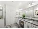 Modern bathroom with double vanity and large mirror at 2022 Canton Park Dr, Winter Haven, FL 33881