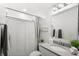 Clean bathroom boasts a vanity with a large mirror and shower/tub combo at 2022 Canton Park Dr, Winter Haven, FL 33881