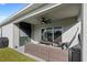 Outdoor patio area with seating and a grassy backyard at 2022 Canton Park Dr, Winter Haven, FL 33881