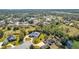 Aerial view of a house and its surroundings near a lake at 217 Pleasant Valley Dr, Daytona Beach, FL 32114