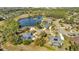 Aerial view of house with pool near lake and community at 217 Pleasant Valley Dr, Daytona Beach, FL 32114